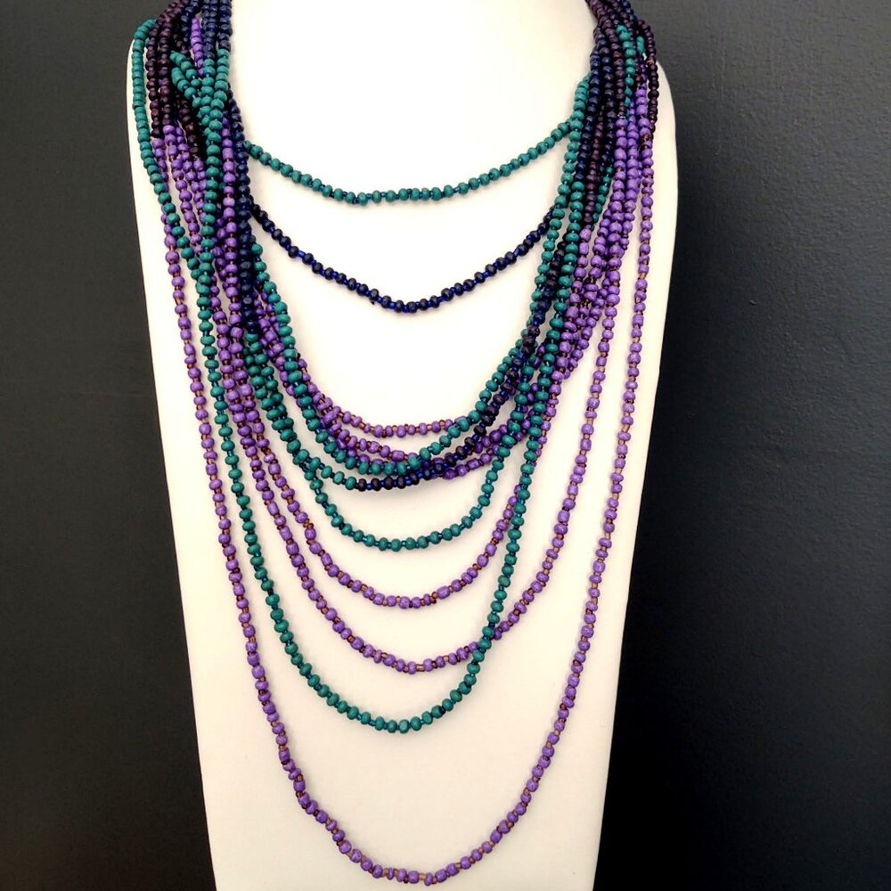 Green, shades of purple and blue layered multi strand beaded necklace